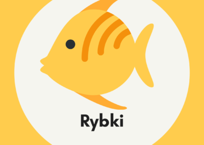 Obrazek przedstawia żółtą rybkę znajdujące się na tle szarego koła a to umiejscowione jest na pomarańczowym tle.